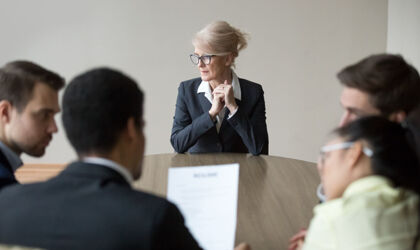 A woman at a job interview in the executive suite 